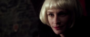 Movie still from “Confessions of a Dangerous Mind” (2002), directed by George Clooney – A person with blonde hair; Close Up shot, Over the shoulder angle