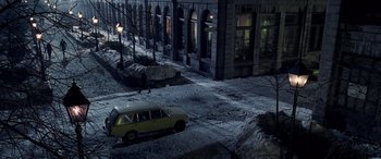 Movie still from “Confessions of a Dangerous Mind” (2002), directed by George Clooney – A car parked on the side of the road at night; Extreme Wide shot, High angle