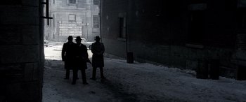 Movie still from “Confessions of a Dangerous Mind” (2002), directed by George Clooney – A group of people standing on the side of a road; Wide shot, High angle
