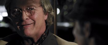 Movie still from “Confessions of a Dangerous Mind” (2002), directed by George Clooney – An older man wearing glasses and a jacket; Close Up shot, Low angle