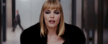 Movie still from “Confessions of a Shopaholic” (2009), directed by P.J. Hogan – A person wearing a fur coat; Close Up shot, Over the shoulder angle