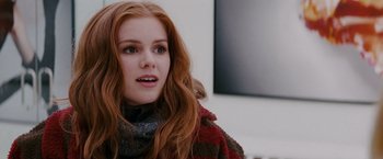 Movie still from “Confessions of a Shopaholic” (2009), directed by P.J. Hogan – A person with long red hair; Close Up shot, Over the shoulder angle