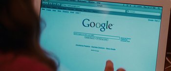 Movie still from “Confessions of a Shopaholic” (2009), directed by P.J. Hogan – Someone is looking at the google homepage on a computer screen; Extreme Close Up shot, High angle