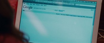 Movie still from “Confessions of a Shopaholic” (2009), directed by P.J. Hogan – A computer screen showing a google search page; Extreme Close Up shot, Over the shoulder angle