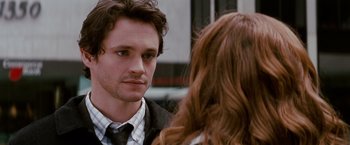 Movie still from “Confessions of a Shopaholic” (2009), directed by P.J. Hogan – A man and a woman talking to each other; Close Up shot, Over the shoulder angle