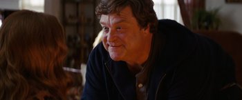 Movie still from “Confessions of a Shopaholic” (2009), directed by P.J. Hogan – A person sitting in a room; Close Up shot, Low angle