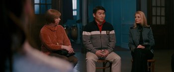 Movie still from “Confessions of a Shopaholic” (2009), directed by P.J. Hogan – A man and a woman sitting on a chair; Medium shot, Over the shoulder angle