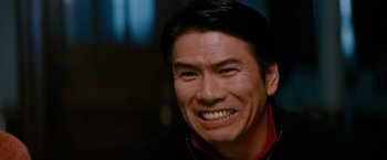 Movie still from “Confessions of a Shopaholic” (2009), directed by P.J. Hogan – A person with a smile on their face; Close Up shot, Low angle