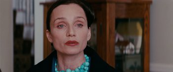 Movie still from “Confessions of a Shopaholic” (2009), directed by P.J. Hogan – A person wearing a necklace; Close Up shot, Over the shoulder angle