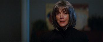 Movie still from “Confessions of a Shopaholic” (2009), directed by P.J. Hogan – A person wearing a black shirt; Close Up shot, Low angle