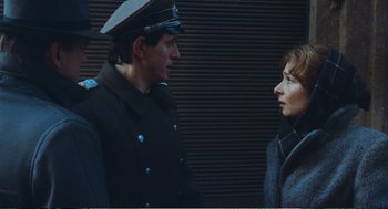 Movie still from “Confidence” (1980), directed by István Szabó – A man and a woman are talking to each other; Close Up shot, Over the shoulder angle