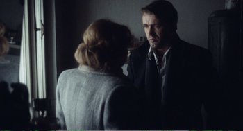 Movie still from “Confidence” (1980), directed by István Szabó – A man and a woman are looking at each other; Medium shot, Over the shoulder angle
