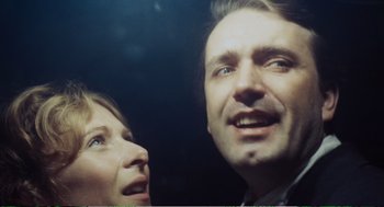 Movie still from “Confidence” (1980), directed by István Szabó – A man and a woman looking up at the sky; Close Up shot, Low angle