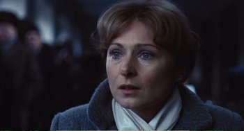 Movie still from “Confidence” (1980), directed by István Szabó – A person wearing a jacket; Close Up shot, Over the shoulder angle