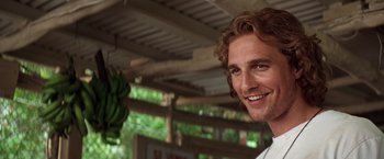 Movie still from “Contact” (1997), directed by Robert Zemeckis – A person smiling for the camera; Close Up shot, Over the shoulder angle