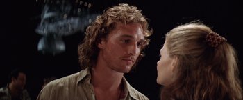 Movie still from “Contact” (1997), directed by Robert Zemeckis – A person with long curly hair; Close Up shot, Over the shoulder angle