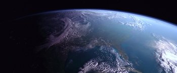 Movie still from “Contact” (1997), directed by Robert Zemeckis – A view of the earth taken from a space station; Extreme Wide shot, Overhead angle