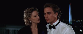 Movie still from “Contact” (1997), directed by Robert Zemeckis – A man and a woman standing next to each other; Close Up shot, Low angle