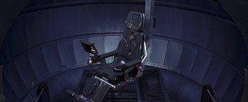 Movie still from “Contact” (1997), directed by Robert Zemeckis – An airplane seat in the middle of a room; Wide shot, Overhead angle