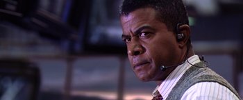 Movie still from “Contact” (1997), directed by Robert Zemeckis – A person wearing a headset; Close Up shot, Low angle