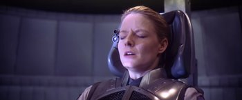 Movie still from “Contact” (1997), directed by Robert Zemeckis – A woman in a space suit with her eyes closed; Close Up shot, Over the shoulder angle