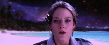 Movie still from “Contact” (1997), directed by Robert Zemeckis – A woman with a headset on her head; Close Up shot, Low angle