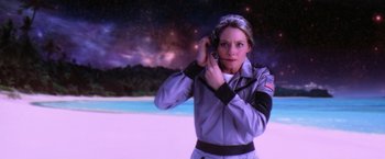 Movie still from “Contact” (1997), directed by Robert Zemeckis – A woman holding a cell phone up to her ear; Medium shot, High angle