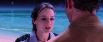 Movie still from “Contact” (1997), directed by Robert Zemeckis – A young woman looking at a man in the water; Close Up shot, Over the shoulder angle