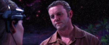 Movie still from “Contact” (1997), directed by Robert Zemeckis – A person wearing a brown shirt; Close Up shot, Over the shoulder angle