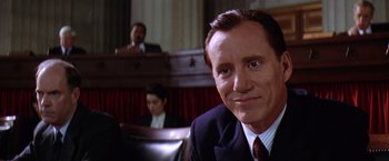 Movie still from “Contact” (1997), directed by Robert Zemeckis – A person wearing a suit and tie; Close Up shot, Low angle