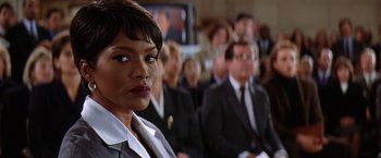 Movie still from “Contact” (1997), directed by Robert Zemeckis – A woman in a crowd of people; Close Up shot, Low angle