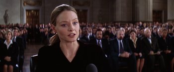 Movie still from “Contact” (1997), directed by Robert Zemeckis – A woman talking to a crowd of people; Close Up shot, Low angle