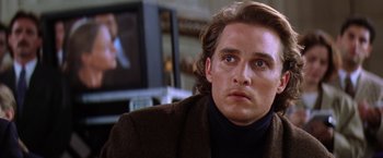 Movie still from “Contact” (1997), directed by Robert Zemeckis – A person sitting in front of a television; Close Up shot, Over the shoulder angle