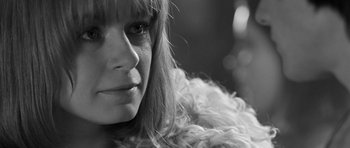 Movie still from “Control” (2007), directed by Anton Corbijn – A person wearing a fur coat; Close Up shot, Over the shoulder angle