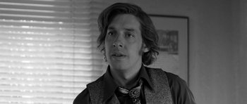 Movie still from “Control” (2007), directed by Anton Corbijn – Black and white photograph of a young man in a tie; Close Up shot, Low angle