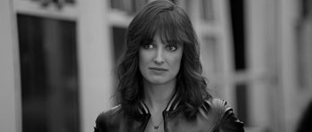 Movie still from “Control” (2007), directed by Anton Corbijn – Black and white photograph of a woman in a leather jacket; Close Up shot, High angle
