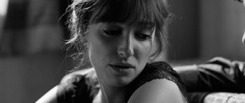 Movie still from “Control” (2007), directed by Anton Corbijn – A person with her eyes closed; Close Up shot, Low angle