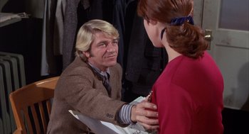 Movie still from “Coogan's Bluff” (1968), directed by Don Siegel – A man and a woman talking to each other; Medium shot, Over the shoulder angle