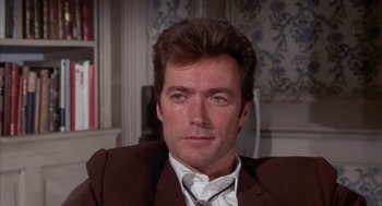 Movie still from “Coogan's Bluff” (1968), directed by Don Siegel – A person wearing a suit and tie; Close Up shot, Low angle