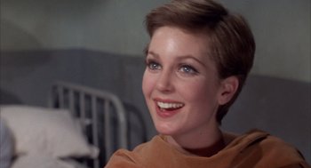 Movie still from “Coogan's Bluff” (1968), directed by Don Siegel – A person with short brown hair; Close Up shot, Low angle