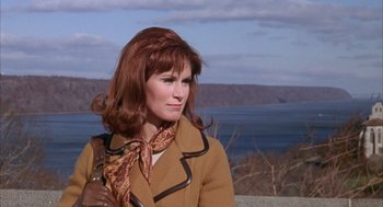 Movie still from “Coogan's Bluff” (1968), directed by Don Siegel – A person wearing a jacket and a scarf; Medium shot, Over the shoulder angle