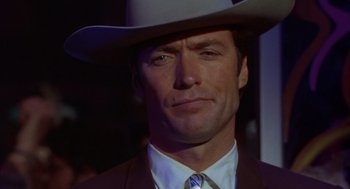 Movie still from “Coogan's Bluff” (1968), directed by Don Siegel – A person wearing a cowboy hat; Close Up shot, Low angle