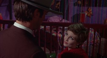 Movie still from “Coogan's Bluff” (1968), directed by Don Siegel – A man and a woman are talking to each other; Close Up shot, Over the shoulder angle