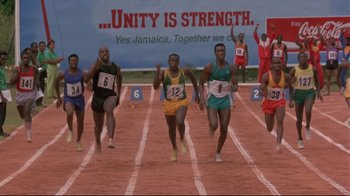 Movie still from “Cool Runnings” (1993), directed by Jon Turteltaub – A group of men running a race on a track; Wide shot, High angle