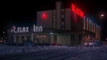 Movie still from “Cool Runnings” (1993), directed by Jon Turteltaub – A large hotel with a lot of snow on the ground; Extreme Wide shot, Low angle
