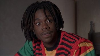 Movie still from “Cool Runnings” (1993), directed by Jon Turteltaub – A person with dreadlocks; Close Up shot, High angle