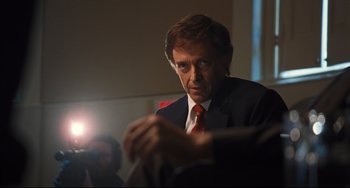 Movie still from “The Front Runner” (2018), directed by Jason Reitman – A person wearing a suit and tie; Close Up shot, Over the shoulder angle