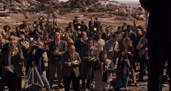 Movie still from “The Front Runner” (2018), directed by Jason Reitman – A large group of people standing in front of some rocks; Wide shot, High angle