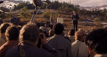 Movie still from “The Front Runner” (2018), directed by Jason Reitman – A group of people standing in front of a microphone; Wide shot, High angle