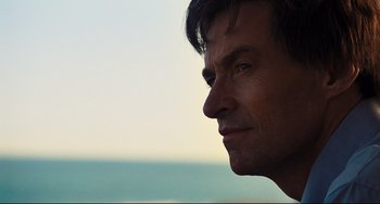 Movie still from “The Front Runner” (2018), directed by Jason Reitman – A man's face with the ocean in the background; Close Up shot, Low angle